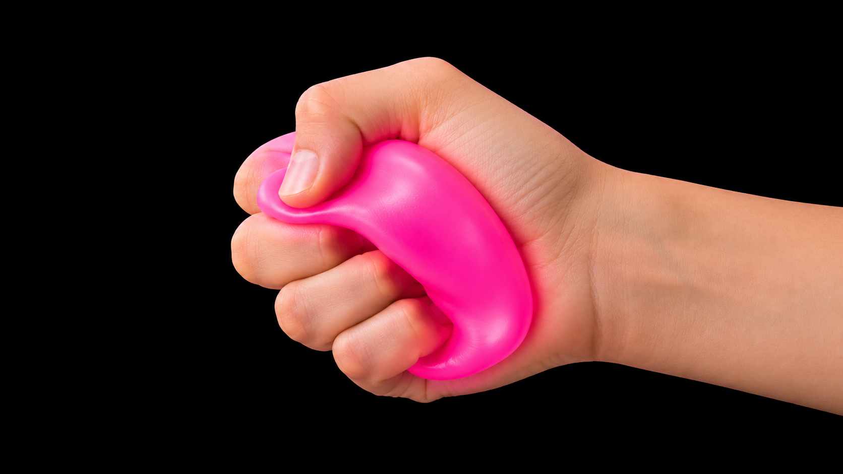 Squeezing a pink Plimbo cube flat in a fist