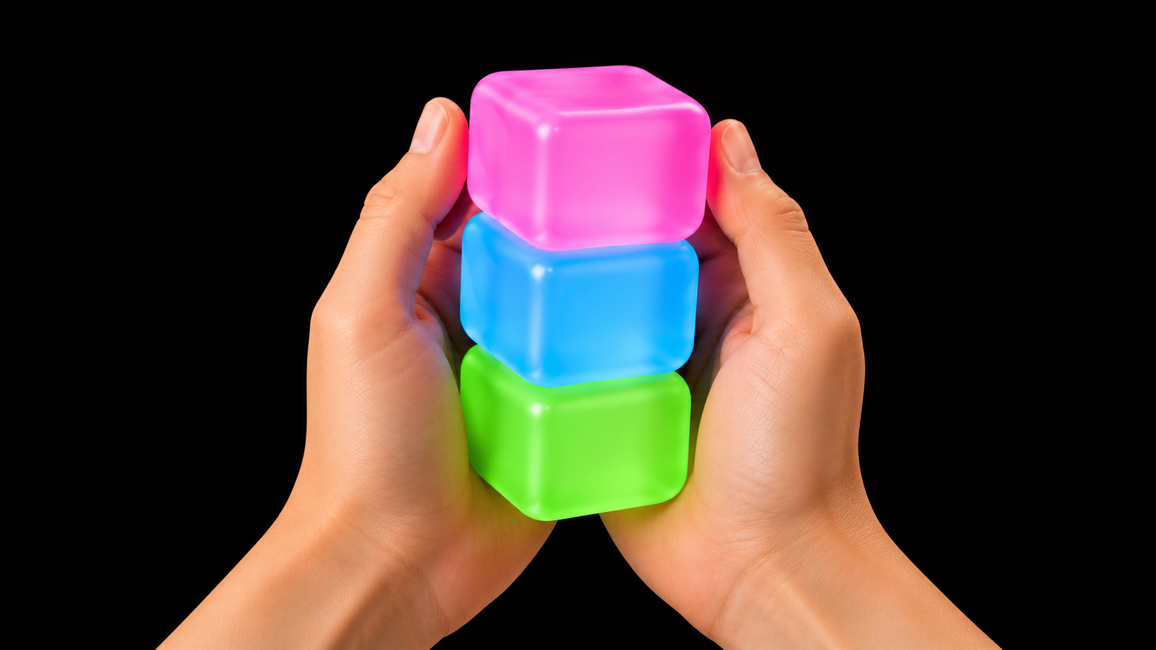Stacking pink, blue and green Plimbo cubes in two hands